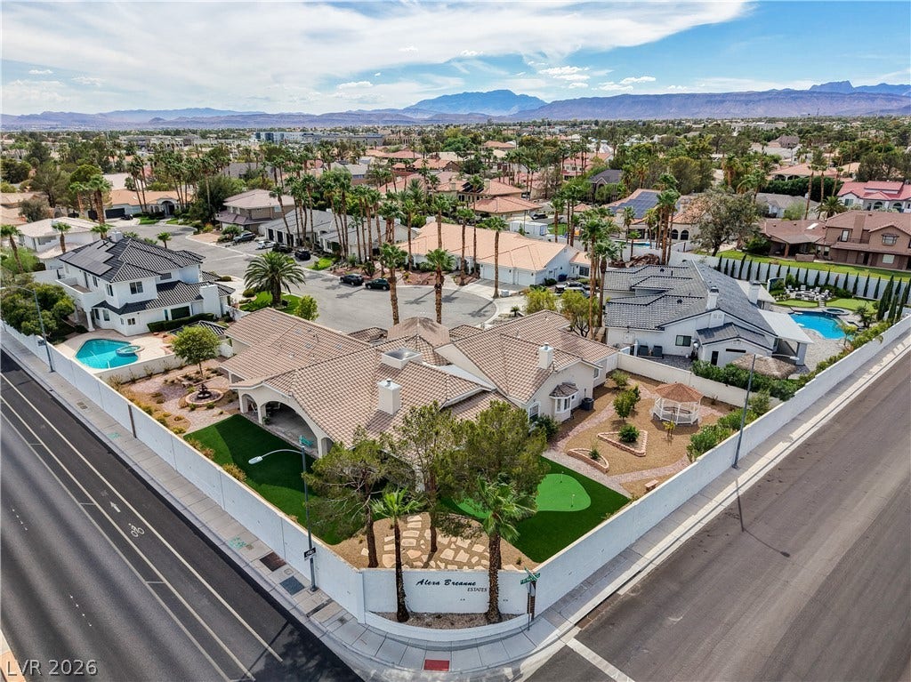 2000 Alexa Breanne Court, Las Vegas, NV 89117 Distant mountains frame this prominent corner property nestled within a quiet neighborhood enclave.