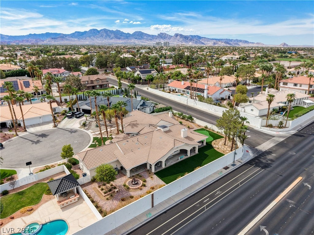2000 Alexa Breanne Court, Las Vegas, NV 89117 Striking desert mountains frame the panoramic horizon above this sprawling residential neighborhood.