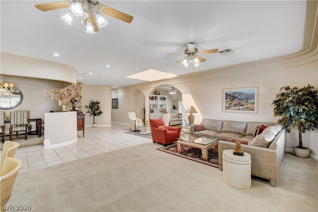 2000 Alexa Breanne Court, Las Vegas, NV 89117 An open layout connects living spaces under high ceilings detailed with recessed lighting.