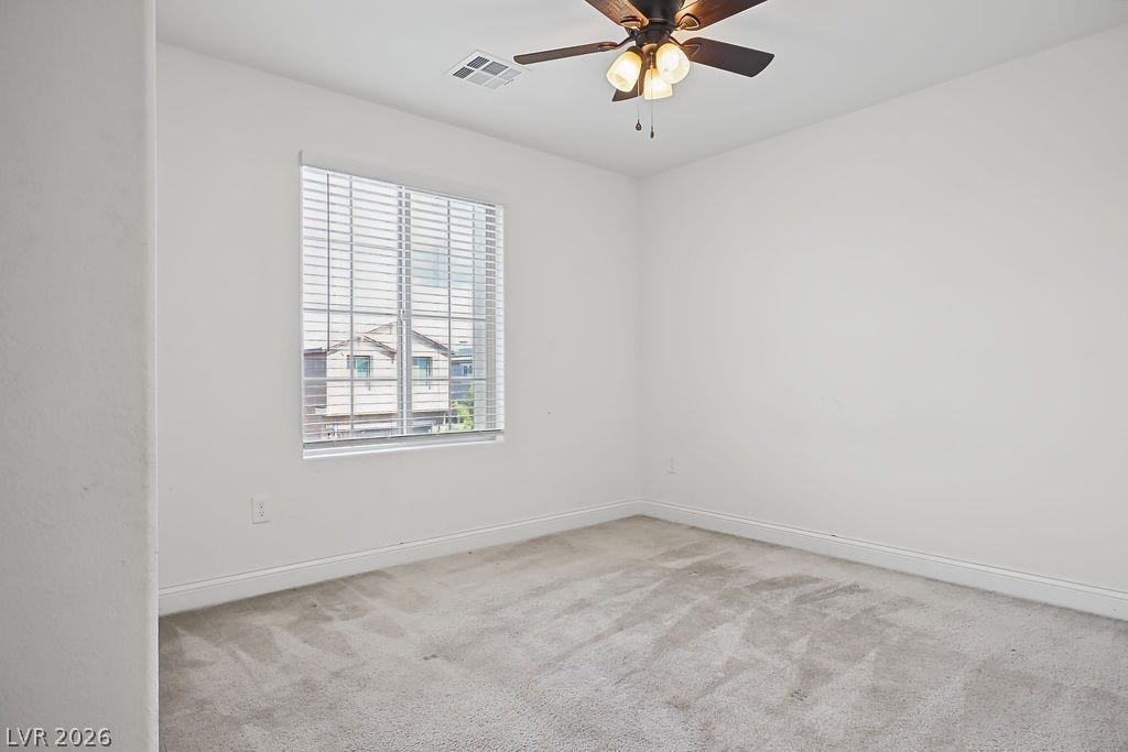 Plush carpeting and natural light define this versatile room.