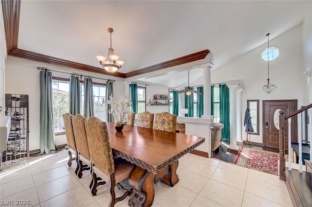 2722 Aspen Wood Avenue, Henderson, NV 89074 Gleaming tile floors and vaulted ceilings elevate this open dining space and entry area.