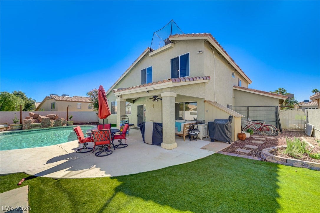 2722 Aspen Wood Avenue, Henderson, NV 89074 A spacious concrete patio and covered lanai overlook the sparkling private pool and lawn.