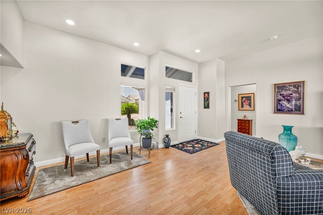 10020 Villa Ridge Drive, Las Vegas, NV 89134 Gleaming hardwood floors and high ceilings create an inviting entryway with abundant natural light.