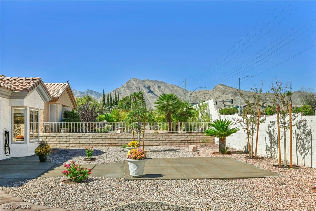 10020 Villa Ridge Drive, Las Vegas, NV 89134 Dramatic mountain views frame the low-maintenance desert landscaping and concrete patio spaces.