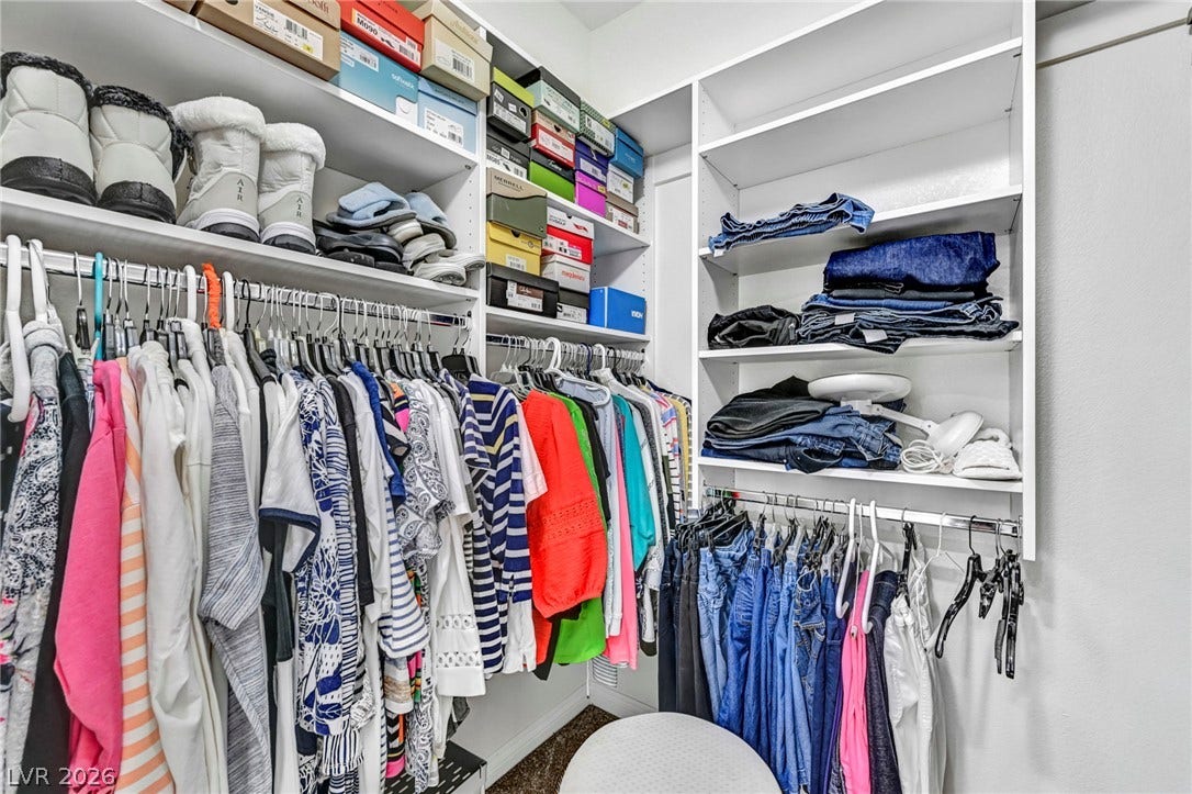 10020 Villa Ridge Drive, Las Vegas, NV 89134 Floor-to-ceiling built-in shelving maximizes storage space in this custom walk-in closet.