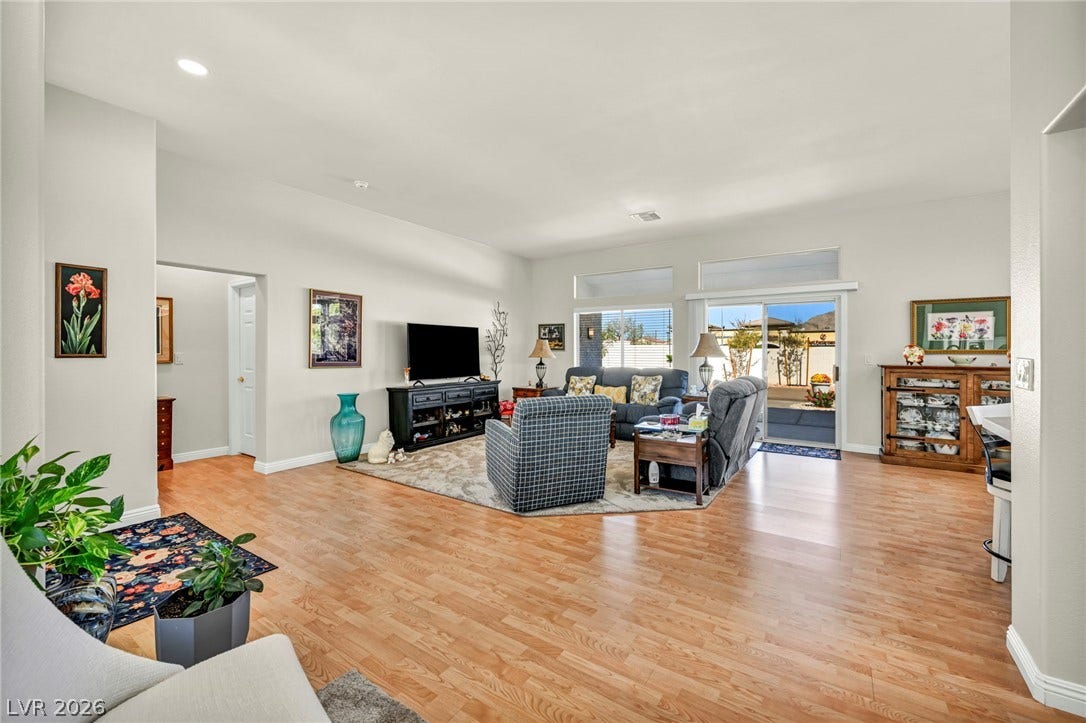 10020 Villa Ridge Drive, Las Vegas, NV 89134 Warm wood flooring and an open floorplan define this inviting living space.