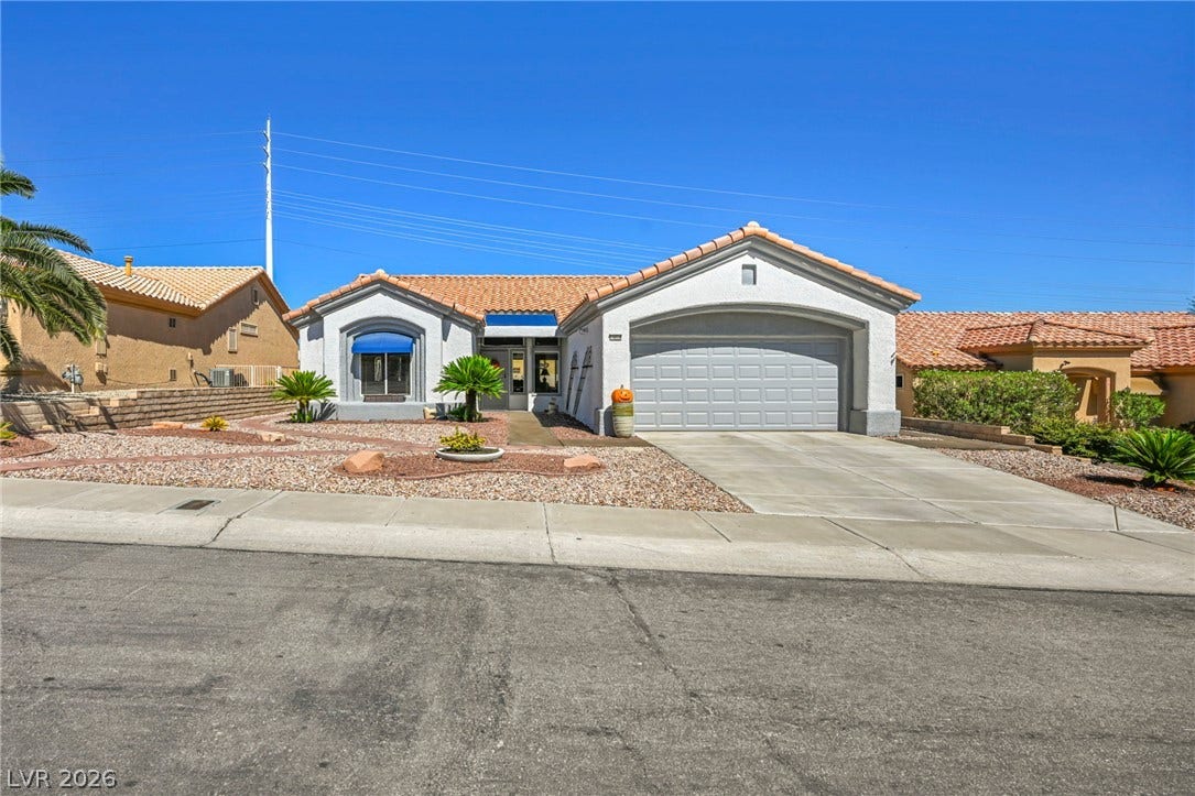 10020 Villa Ridge Drive, Las Vegas, NV 89134 An attractive stucco exterior highlights this classic single-story home with a tiled roof.