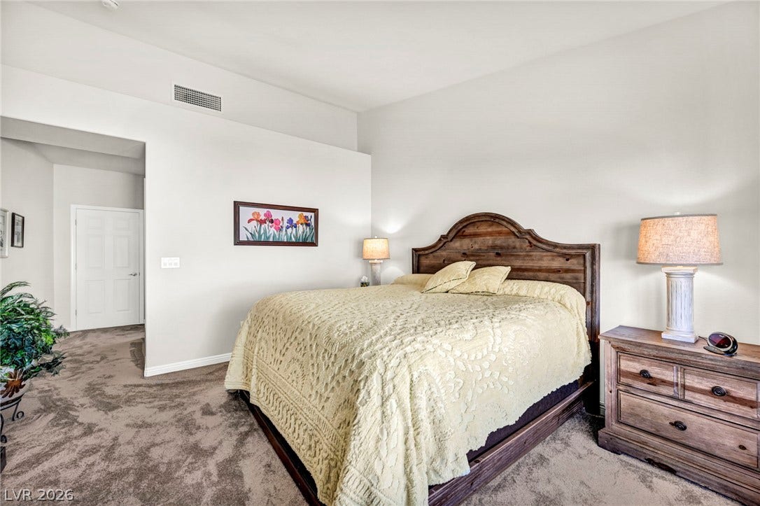 10020 Villa Ridge Drive, Las Vegas, NV 89134 High ceilings and soft carpeting define this restful sleeping space.