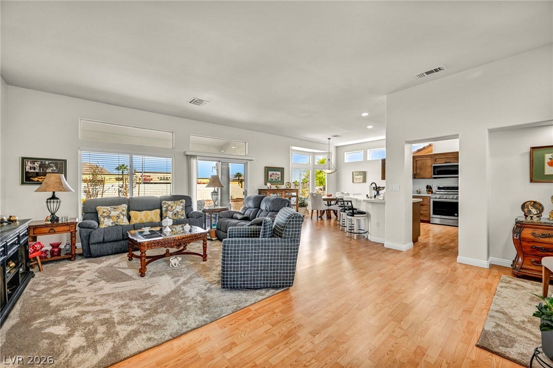 10020 Villa Ridge Drive, Las Vegas, NV 89134 Gleaming hardwood floors and a spacious open layout connect the primary living areas.