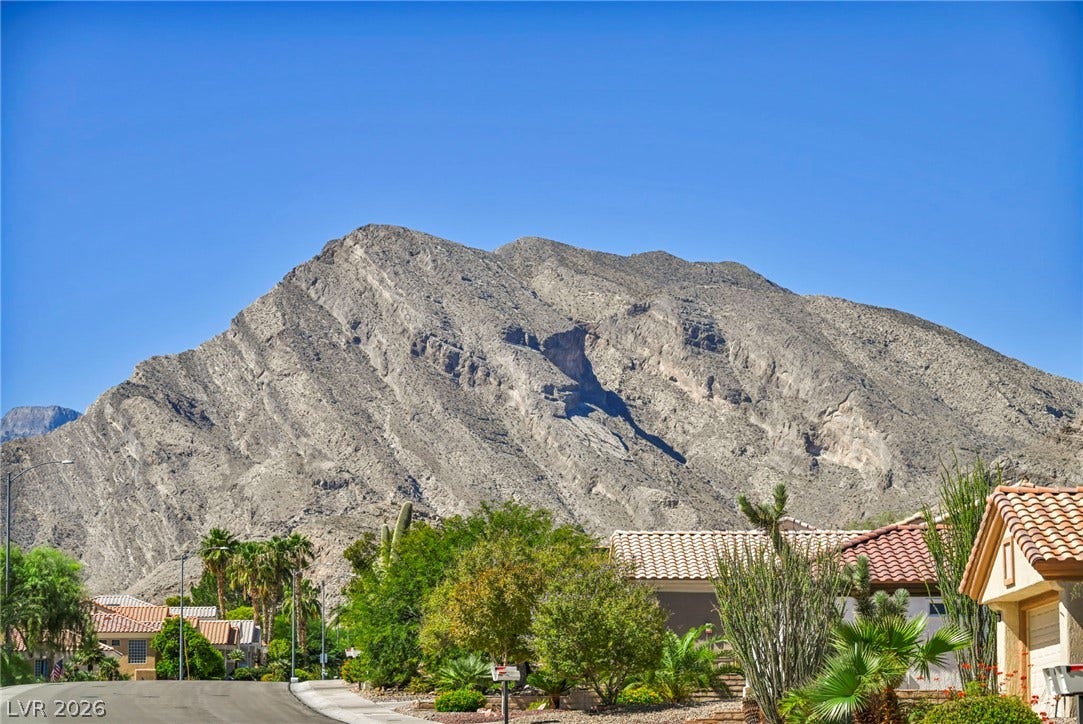 10020 Villa Ridge Drive, Las Vegas, NV 89134 Soaring desert peaks provide a dramatic and rugged backdrop above the neighborhood.