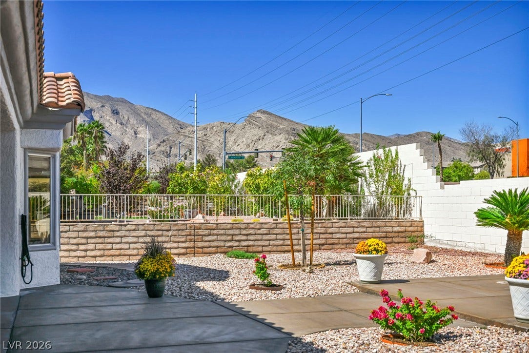 10020 Villa Ridge Drive, Las Vegas, NV 89134 Dramatic mountain vistas rise behind the low-maintenance desert landscaping and solid block perimeter walls.
