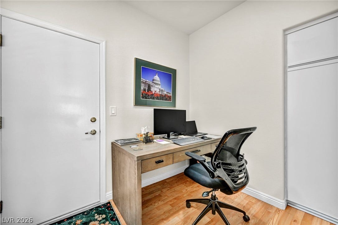 10020 Villa Ridge Drive, Las Vegas, NV 89134 Smooth wood floors and crisp white walls define this versatile home workspace.