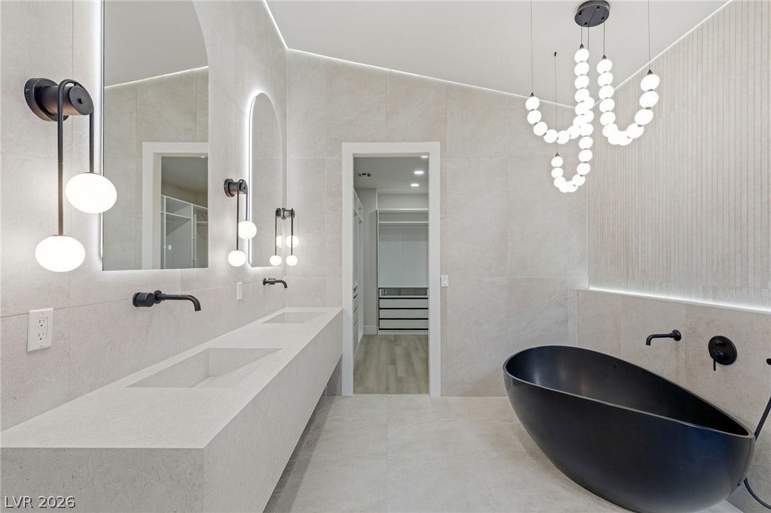 10626 San Vercelli Court, Las Vegas, NV 89141 Clean lines and a freestanding tub define this contemporary bathroom space.