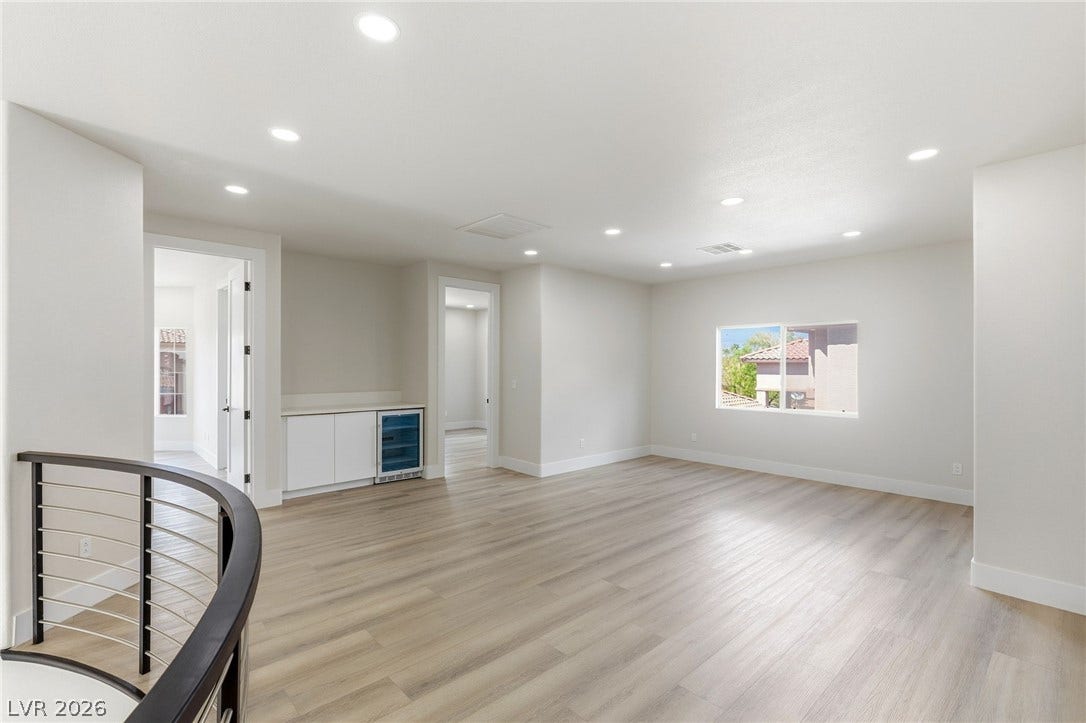 10626 San Vercelli Court, Las Vegas, NV 89141 Clean lines and light wood flooring define this versatile upstairs loft area.