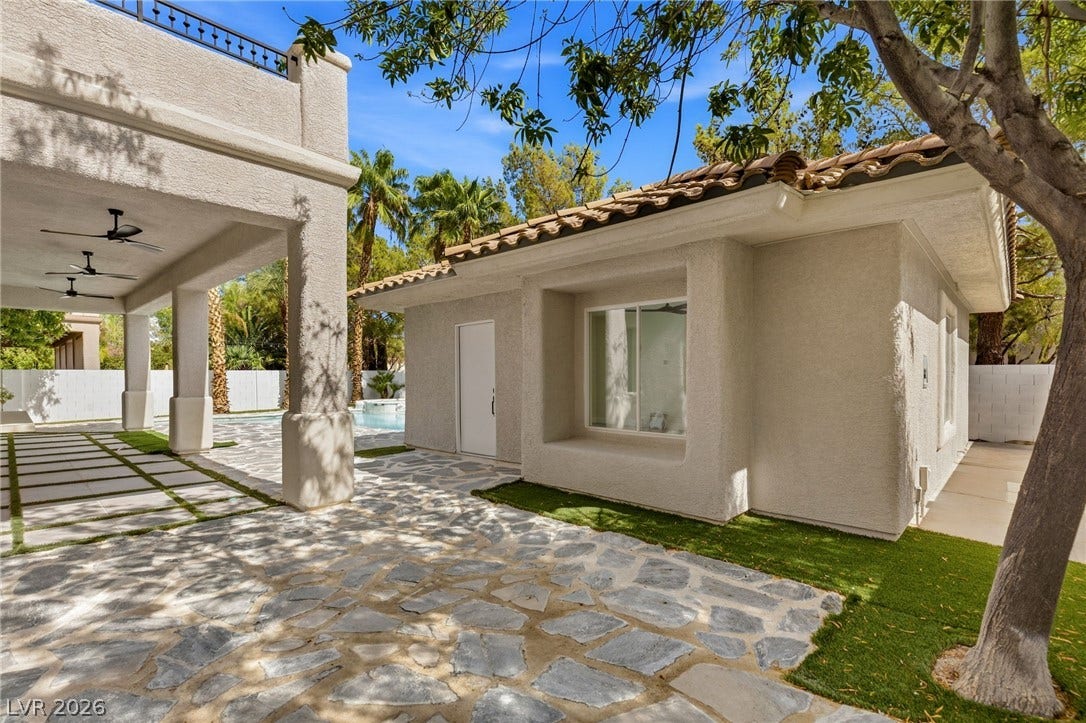 10626 San Vercelli Court, Las Vegas, NV 89141 An inviting stone patio connects the main house with a detached guest suite.