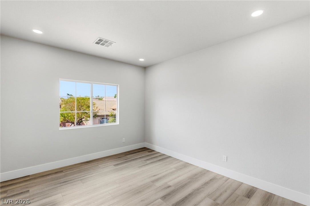 10626 San Vercelli Court, Las Vegas, NV 89141 Recessed lighting and wide-plank flooring define this versatile auxiliary space.