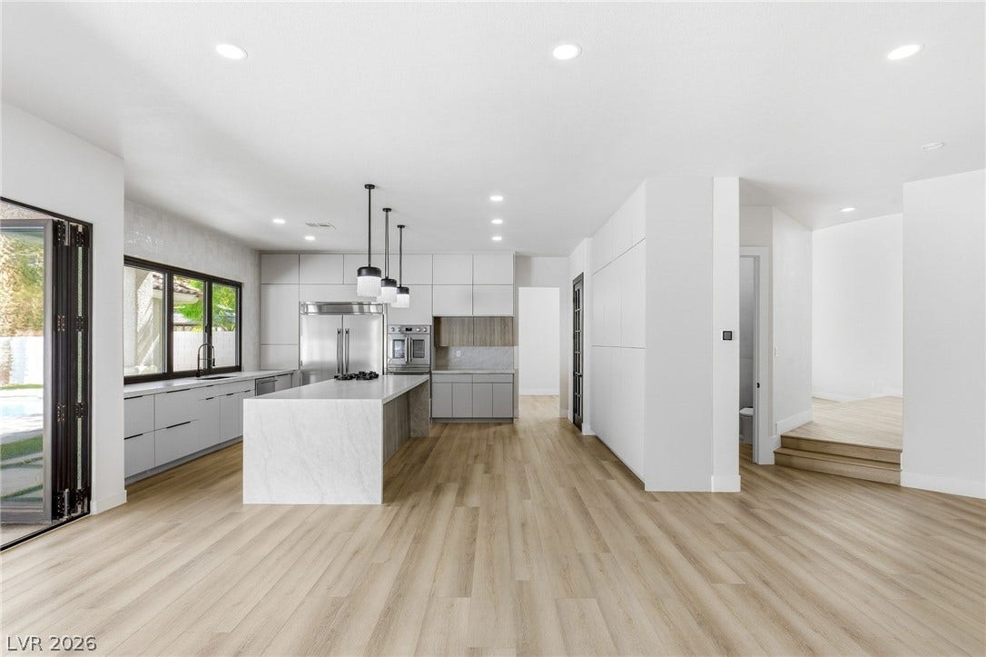 10626 San Vercelli Court, Las Vegas, NV 89141 An open floorplan seamlessly connects the airy kitchen to light-filled living spaces.