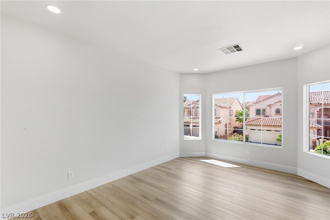10626 San Vercelli Court, Las Vegas, NV 89141 Clean lines and smooth flooring define this versatile room with multi-directional neighborhood views.