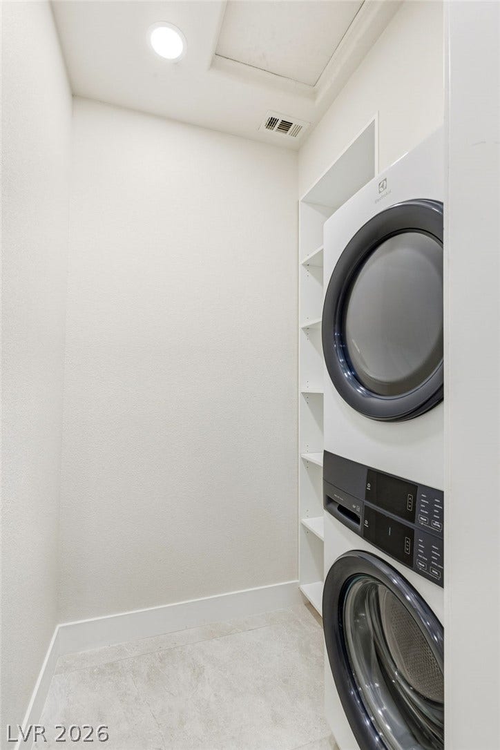 10626 San Vercelli Court, Las Vegas, NV 89141 Functional tile flooring and built-in shelving maximize space in this efficient laundry closet.