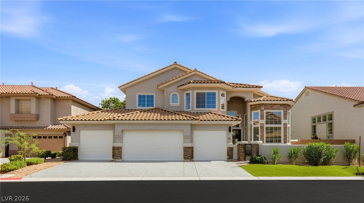 10626 San Vercelli Court, Las Vegas, NV 89141 A spacious driveway and multi-car garage anchor this elegant two-story stucco exterior design.