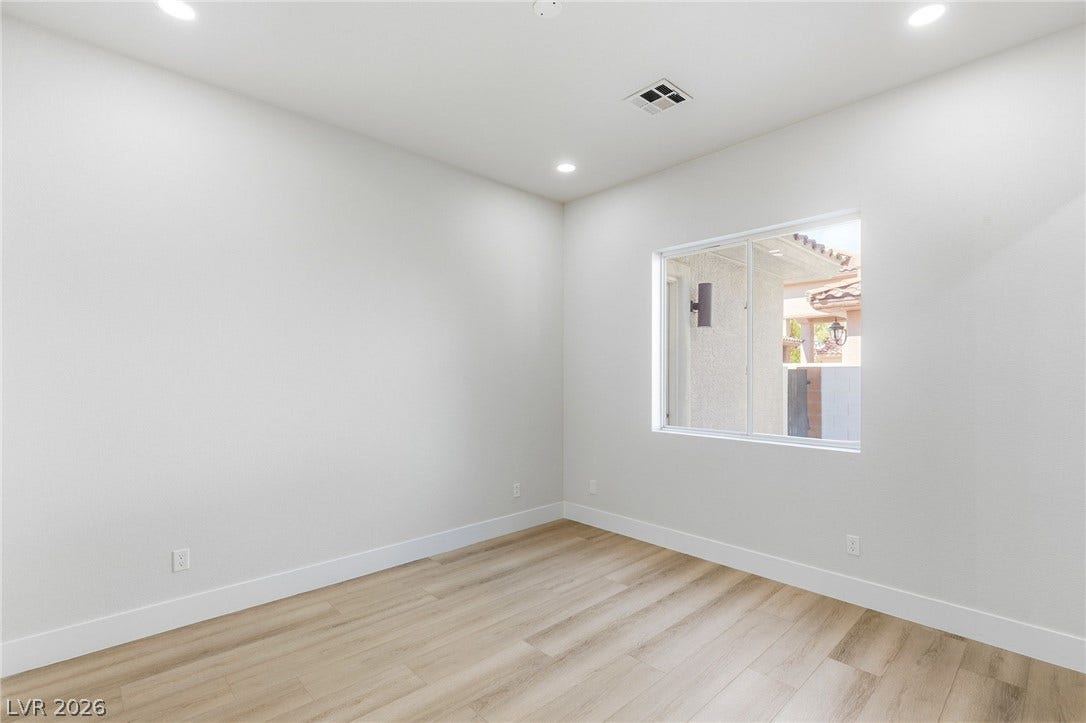 10626 San Vercelli Court, Las Vegas, NV 89141 Clean lines and smooth flooring define this minimalist interior space.