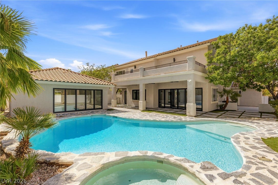 10626 San Vercelli Court, Las Vegas, NV 89141 An inviting backyard oasis features a shimmering pool bordered by stone pavers.
