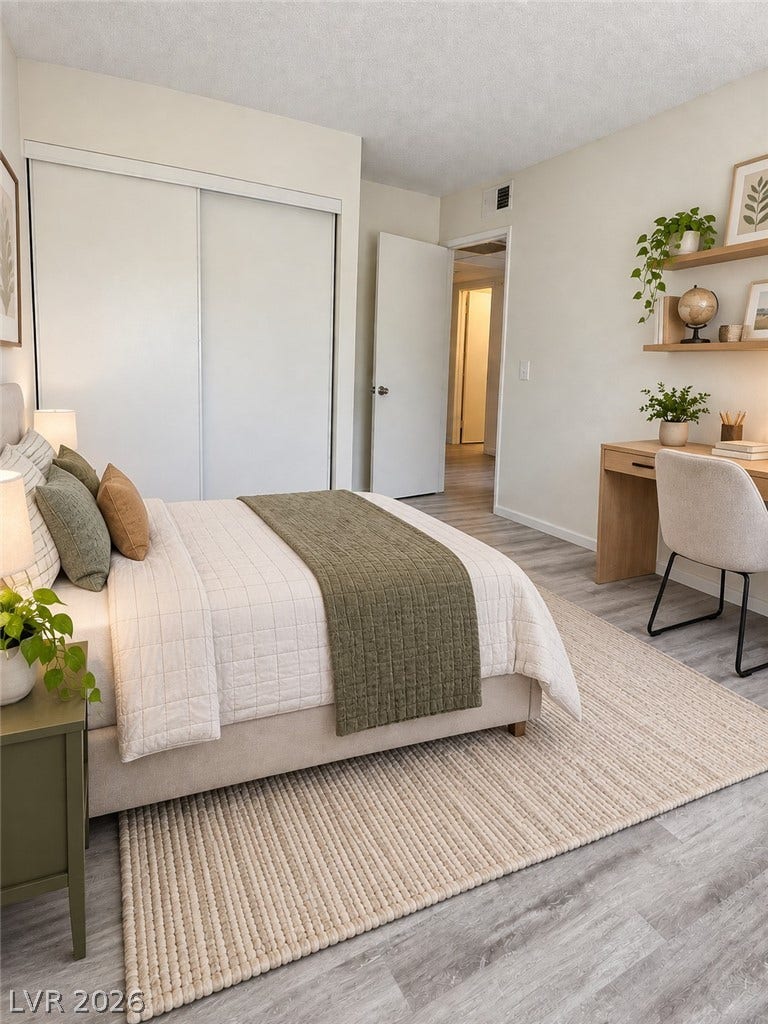 Virtually Staged Smooth plaster walls and clean-lined wood flooring anchor this peaceful bedroom sanctuary.