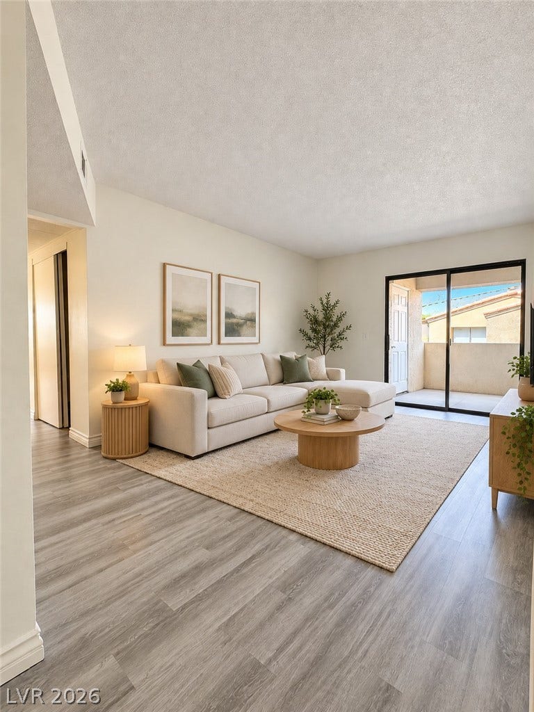 Virtually Staged Sliding glass doors open from the living area to a private outdoor balcony.