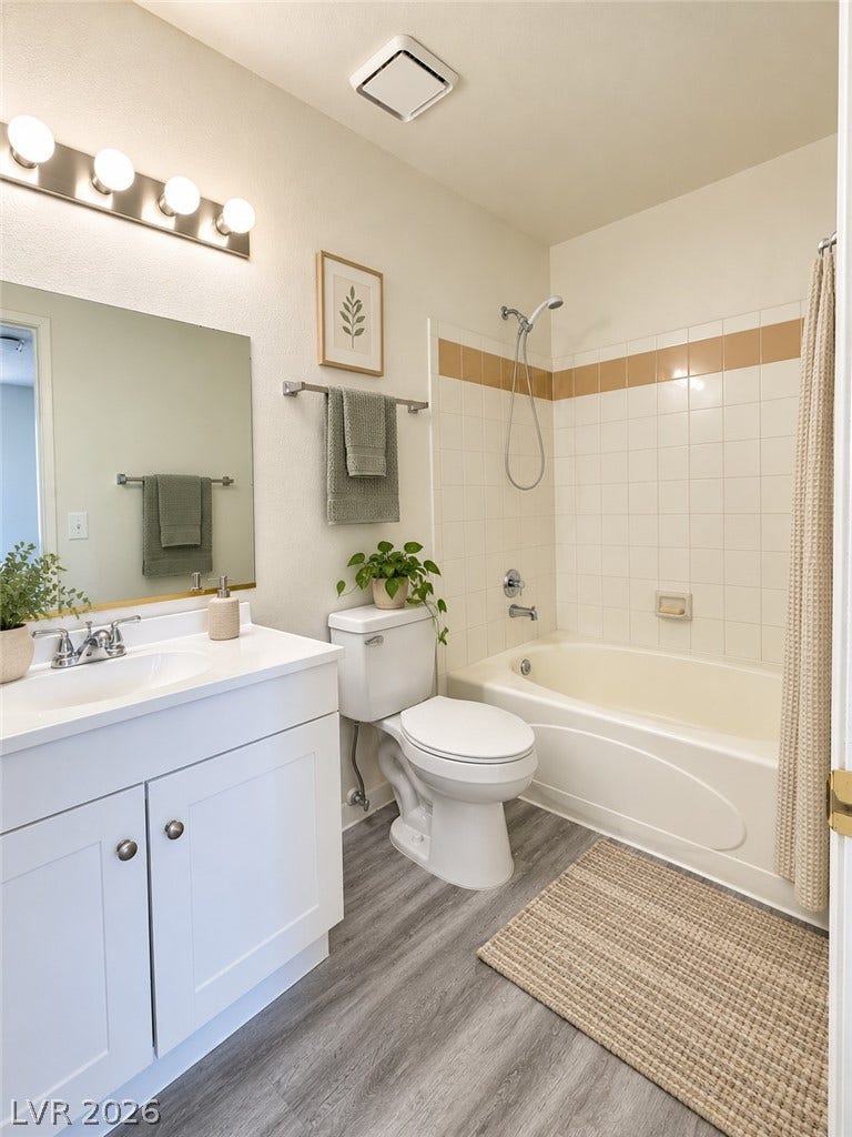 Virtually Staged Clean lines and classic tile finishes define this functional bathroom space.