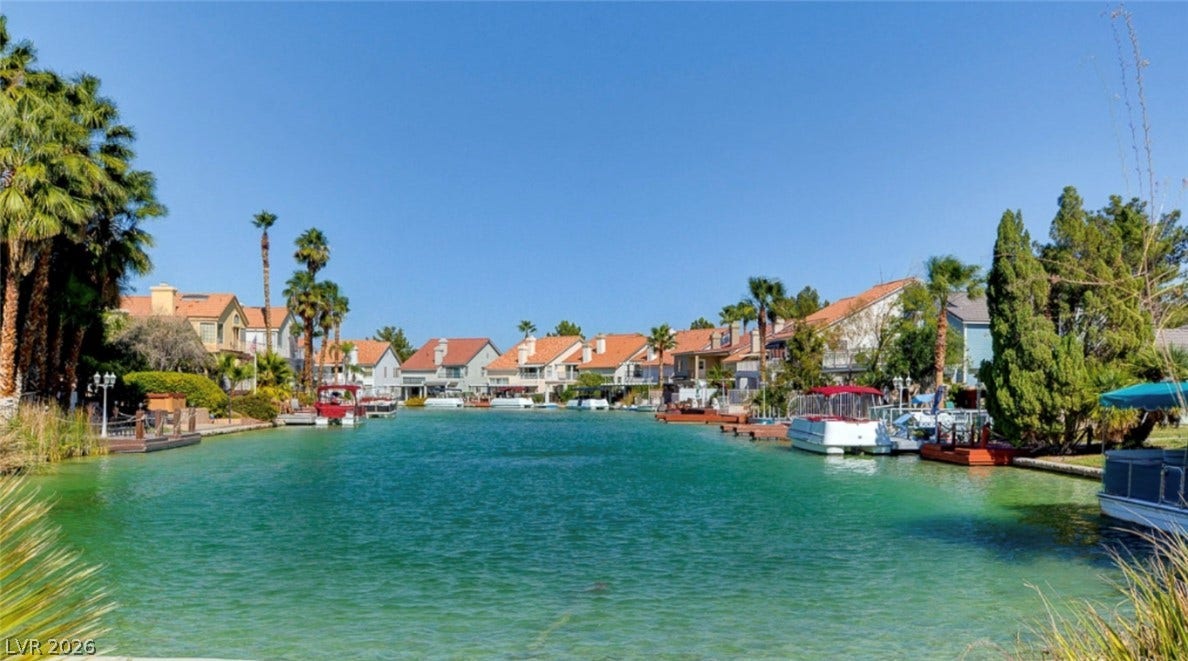 Serene water views extend along the canal lined with private docks and homes.