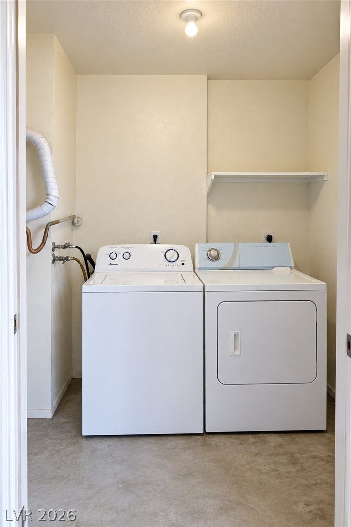 A dedicated laundry closet includes hookups alongside resilient concrete flooring.