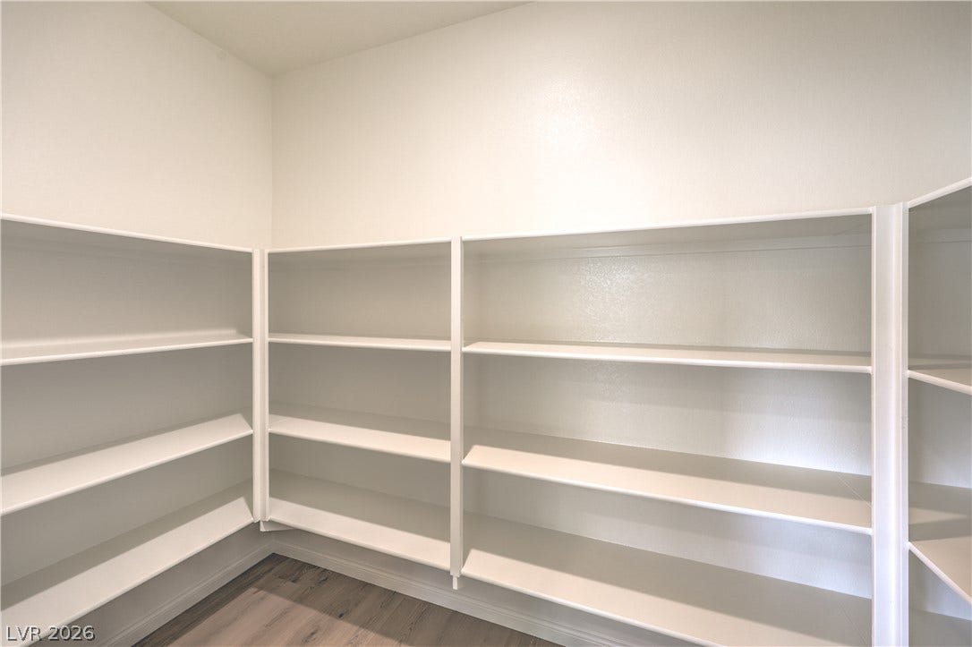 568 Ivory Peacock Ct, Henderson, NV 89011 Generous wrap-around shelving units maximize storage capacity over durable wood-look flooring.