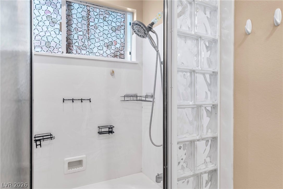 688 Canfield Point Avenue, Las Vegas, NV 89183 Glass block details complement this clean, functional shower design.