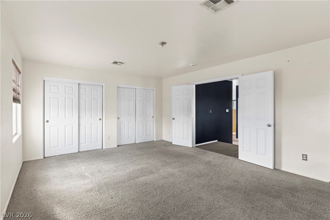 688 Canfield Point Avenue, Las Vegas, NV 89183 Plentiful closet doors and wall-to-wall carpeting define this versatile secondary bedroom space.