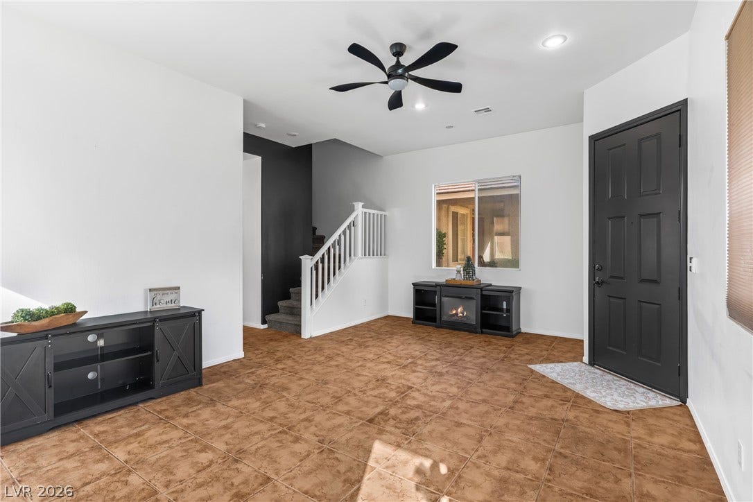 688 Canfield Point Avenue, Las Vegas, NV 89183 Elegantly tiled floors and high ceilings frame this versatile entry space.