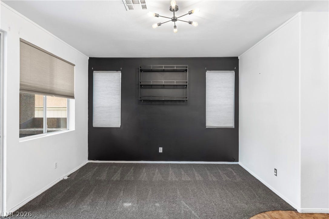 688 Canfield Point Avenue, Las Vegas, NV 89183 A versatile secondary room showcases plush carpeting and modern wall-mounted shelving.