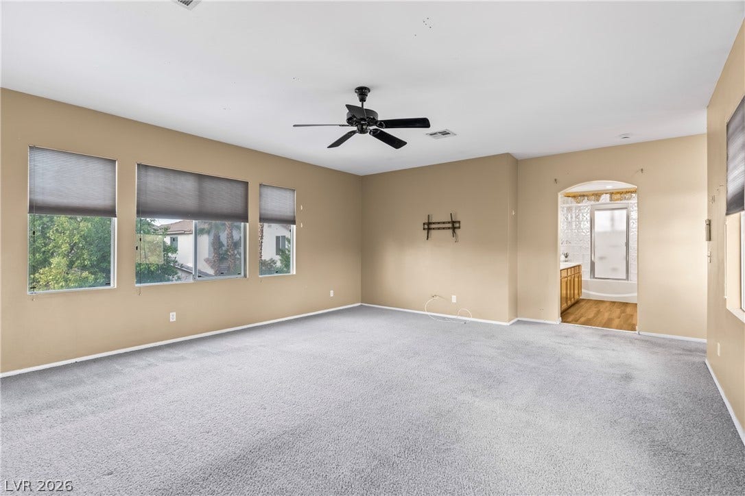 688 Canfield Point Avenue, Las Vegas, NV 89183 Generous windows fill this versatile bedroom with abundant natural light.