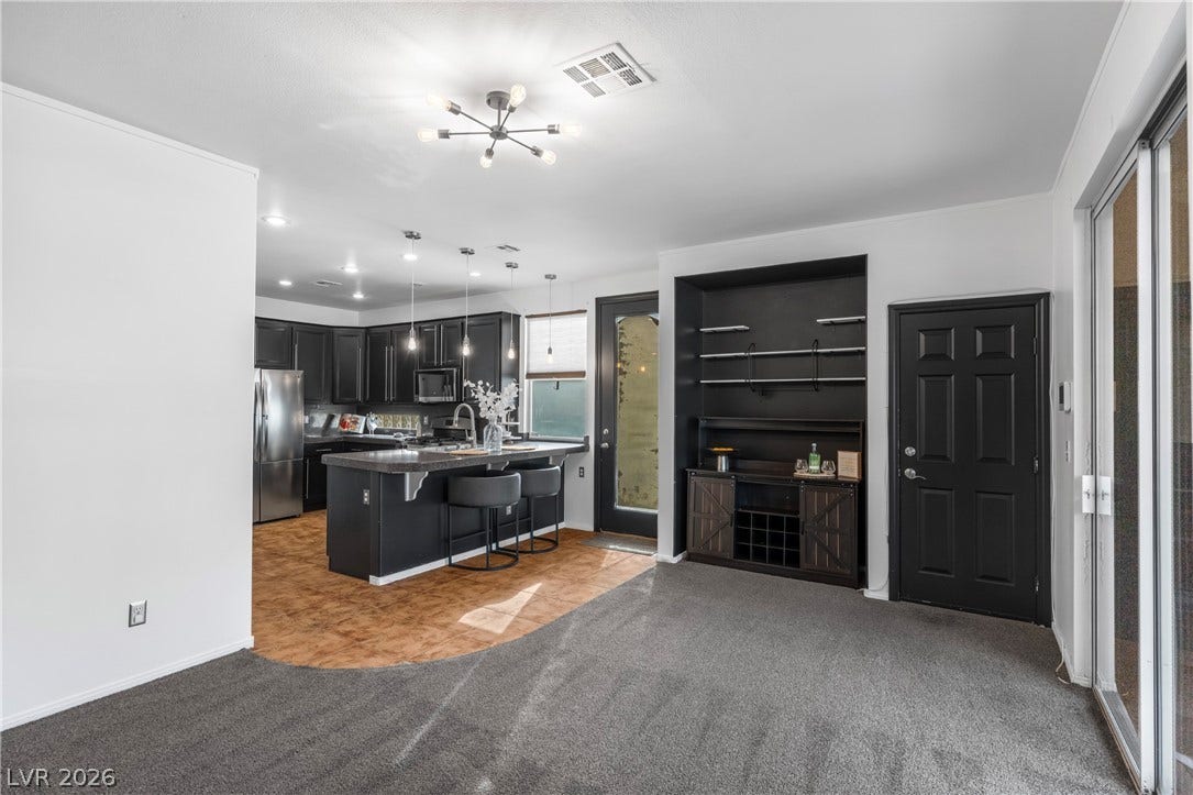 688 Canfield Point Avenue, Las Vegas, NV 89183 An open floor plan seamlessly connects the comfortable living area directly into the modern kitchen.