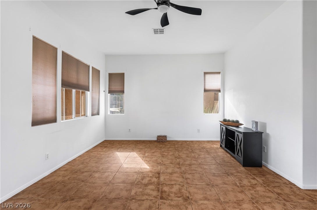 688 Canfield Point Avenue, Las Vegas, NV 89183 Warm tile flooring and abundant natural light create an inviting atmosphere in this versatile space.