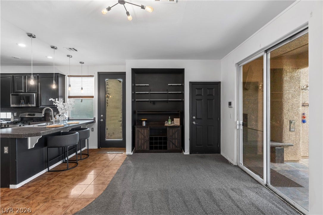 688 Canfield Point Avenue, Las Vegas, NV 89183 Sliding glass doors open from the versatile living and dining area to the patio.