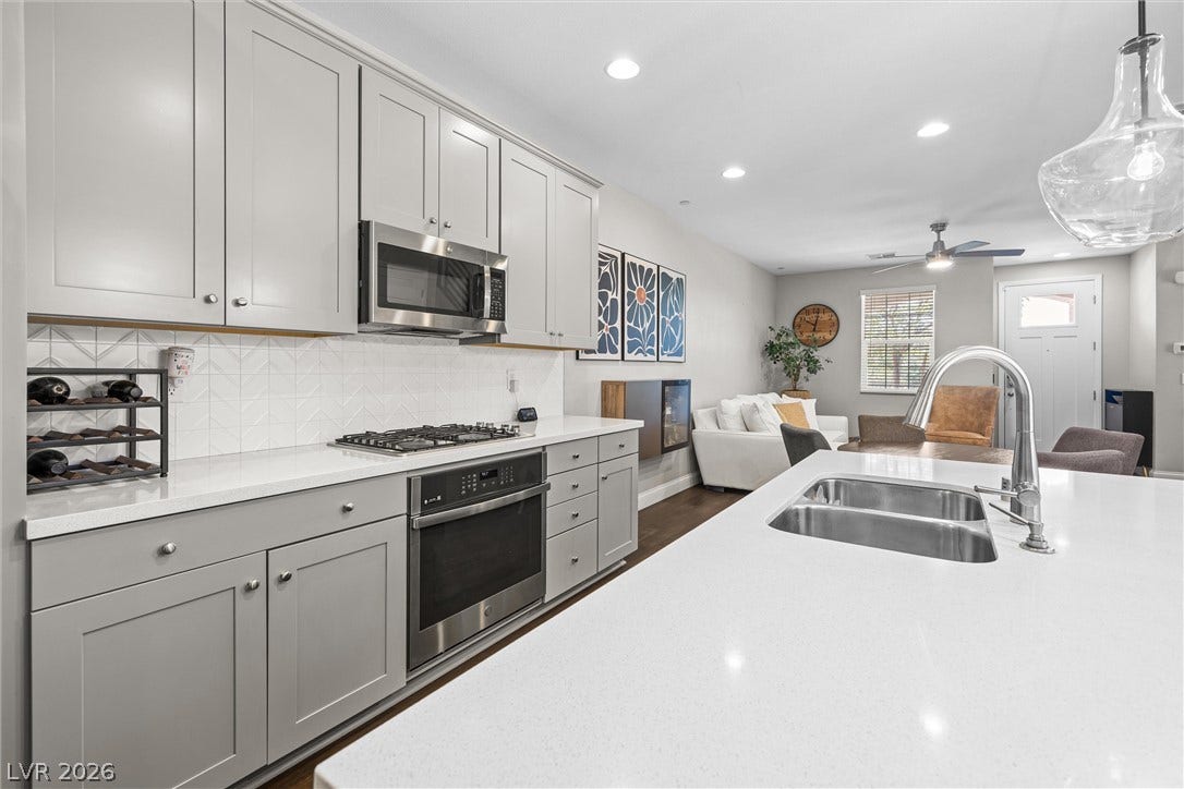 44 Kimberlite Drive, Henderson, NV 89011 This kitchen features sleek countertops, modern appliances, and seamless open-concept living.