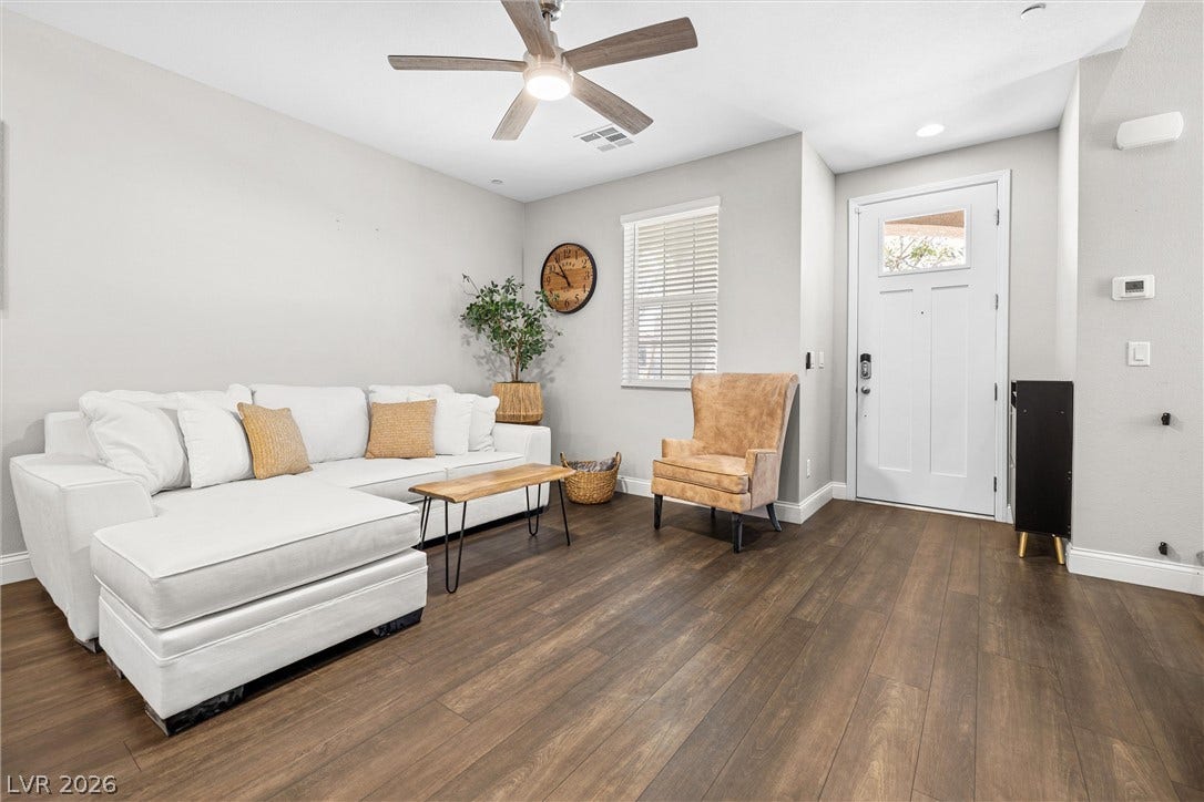 44 Kimberlite Drive, Henderson, NV 89011 This contemporary living area boasts rich hardwood floors and abundant natural light.