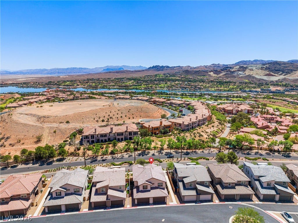 44 Kimberlite Drive, Henderson, NV 89011 This elevated view captures the extensive community with its serene lake and distant mountains.