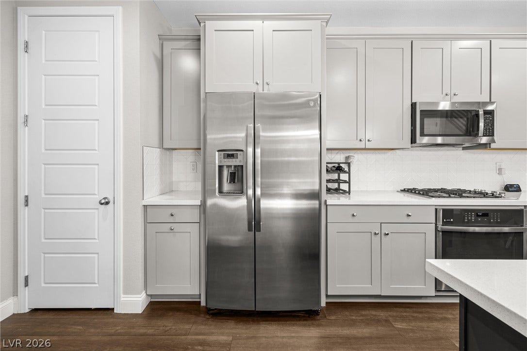 44 Kimberlite Drive, Henderson, NV 89011 This modern kitchen features sleek appliances and ample storage, creating an inviting culinary space.