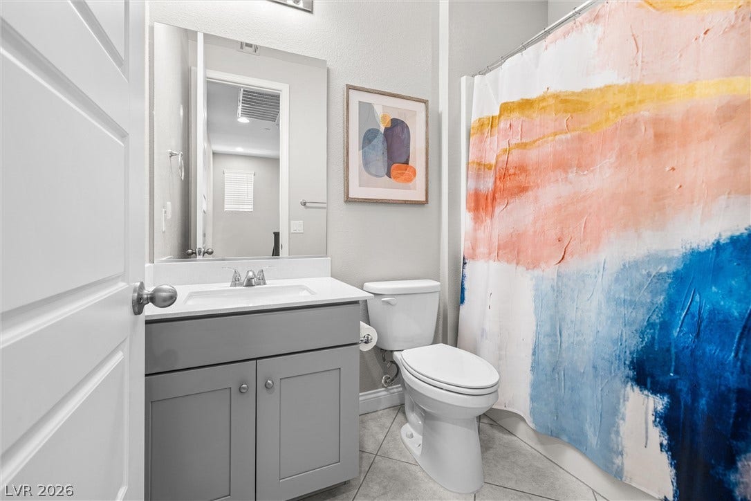 44 Kimberlite Drive, Henderson, NV 89011 This bright bathroom features sleek vanity and modern fixtures.