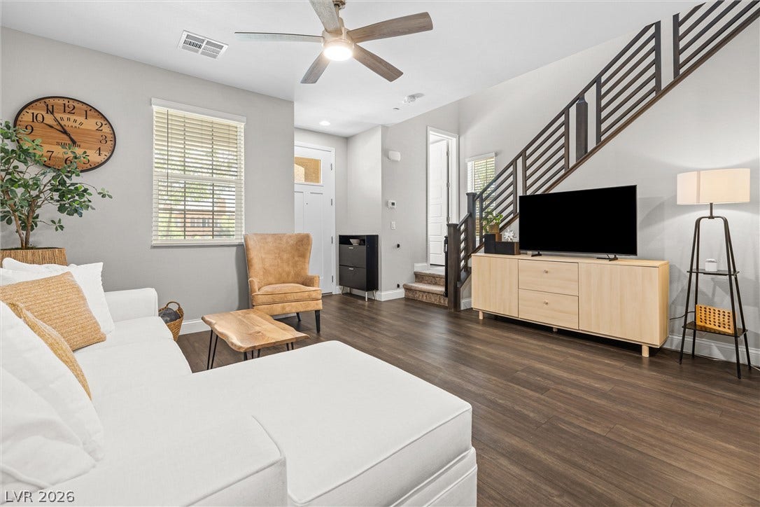 44 Kimberlite Drive, Henderson, NV 89011 This inviting living space features rich hardwood floors and a striking staircase.