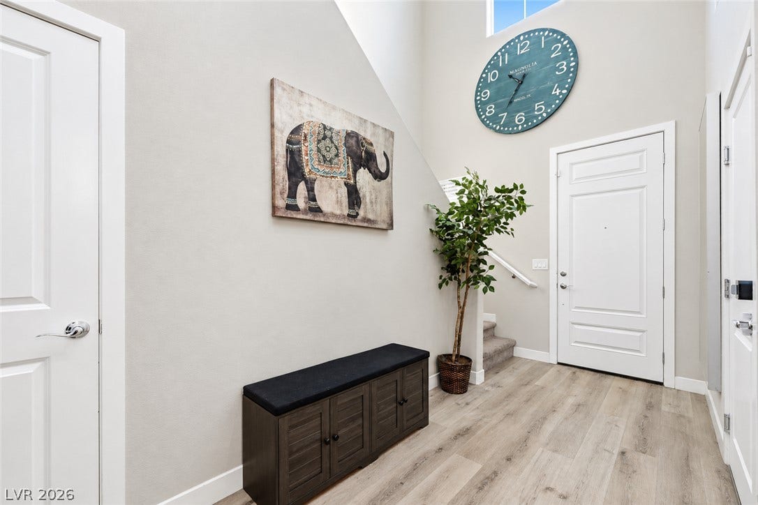 31 Cresta Villa Court, Henderson, NV 89011 High ceilings and durable wood-look flooring welcome guests into this bright entryway.