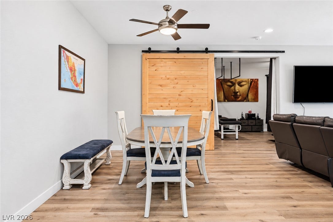 31 Cresta Villa Court, Henderson, NV 89011 Smooth wood floors flow seamlessly through this versatile open-concept dining area.