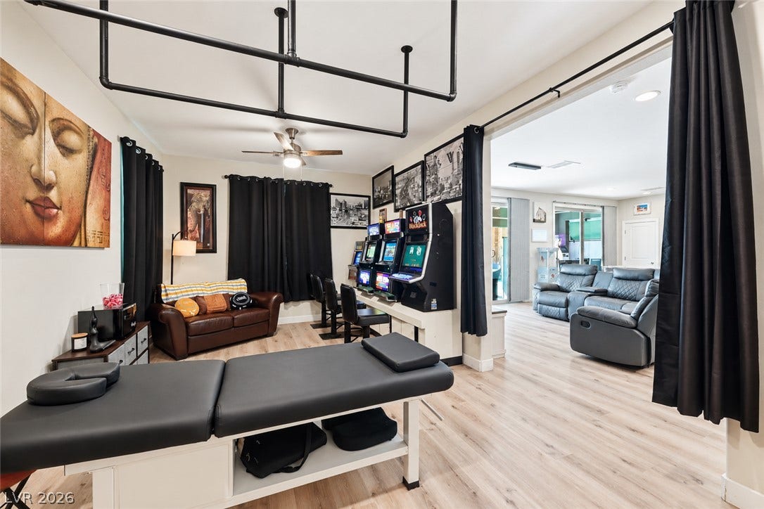 31 Cresta Villa Court, Henderson, NV 89011 Smooth wood-look flooring and an expansive wide doorway connect these versatile living spaces.