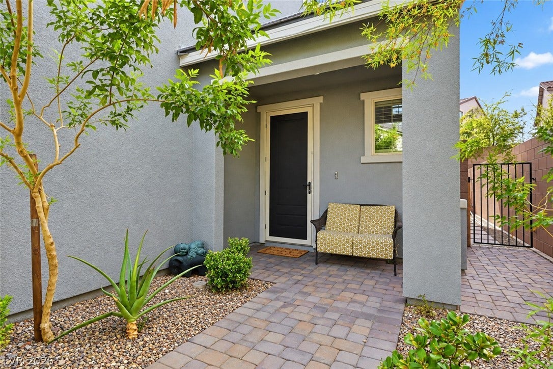 31 Cresta Villa Court, Henderson, NV 89011 A welcoming front porch with classic pavers leads to the inviting entryway.